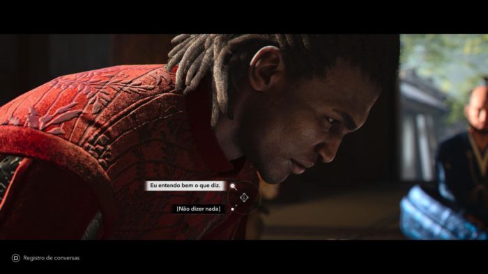 O personagem Yasuke, de Assassin's Creed Shadows, um homem negro com dreadlocks no cabelo, faz uma reverência.